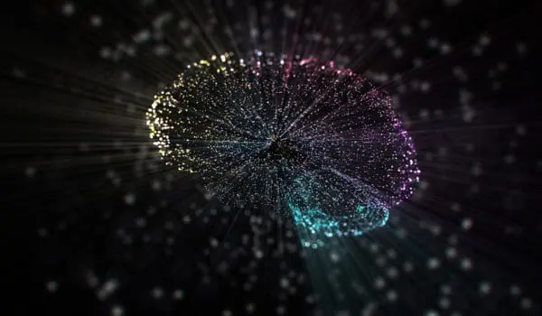 A digital representation of a brain made up of interconnected points and lines, illuminated against a dark background.