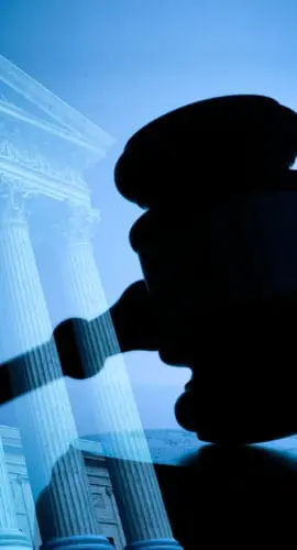 A gavel and the United States Supreme Court building.