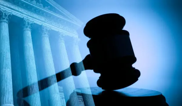 A gavel and the United States Supreme Court building.