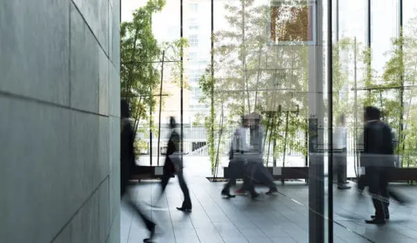 Business person walking in a urban building