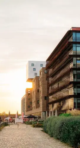 New residential neighbourhood on the background of old architecture in Berlin in summer at sunset