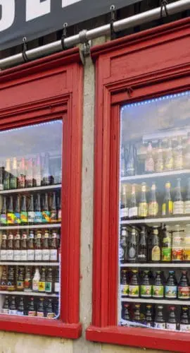 Beer Store's Window in Ghent, Belgium. Beer in Belgium varies from pale lager to amber ales, lambic beers, Flemish red ales, sour brown ales, strong ales and stouts. There are approximately hundreds of active breweries in Belgium.