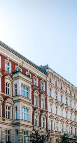 A stunning view of historic residential buildings in Berlin, Germany, showcasing classical architecture on a clear day.