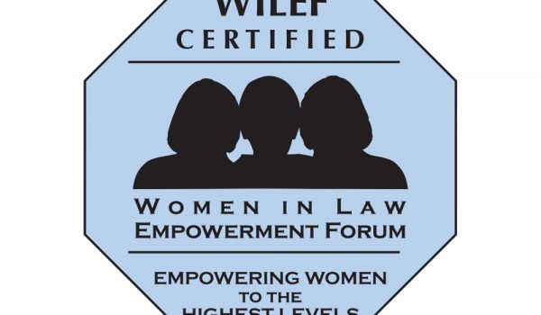 A blue octagonal emblem featuring the text "WILEF Certified - Women in Law Empowerment Forum - Empowering Women to the Highest Levels" along with silhouettes of three women.