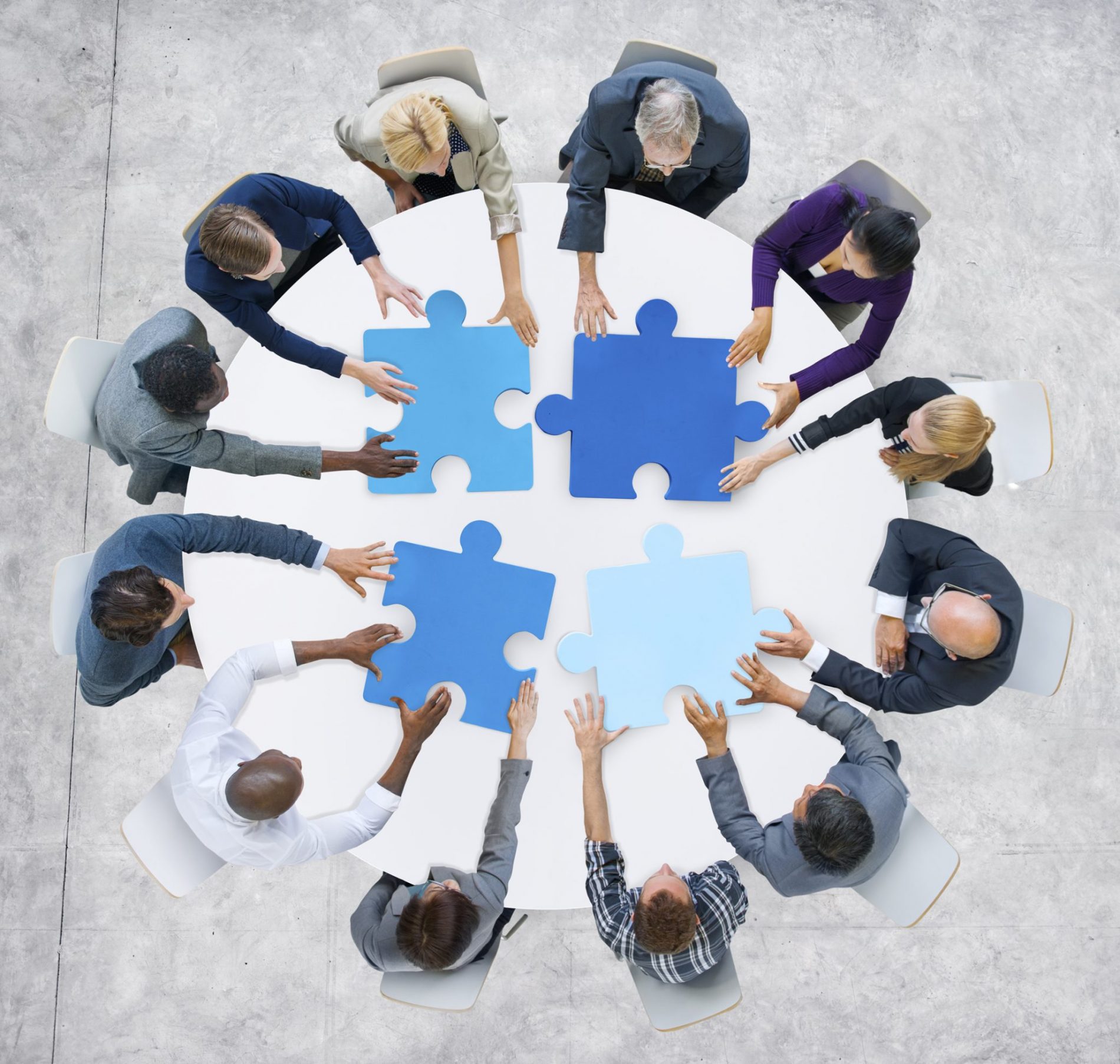 Business People And Jigsaw Puzzle Pieces