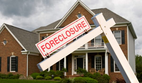 Foreclosure Sign In Front On Modern House