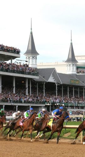 Horses rounding a turn in the Kentucky Derby race