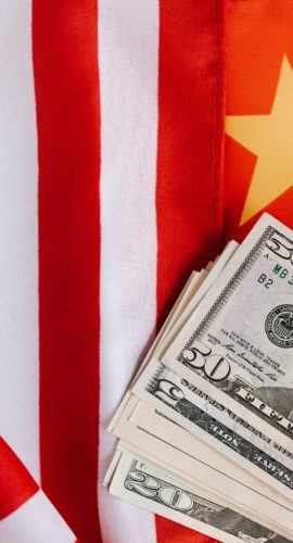 American and chinese flags and usa dollars
