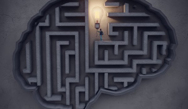 The man find and turn on the lightbulb in the maze-shaped brain on the wall, symbolizing big ideas, innovation concepts. (3d render)