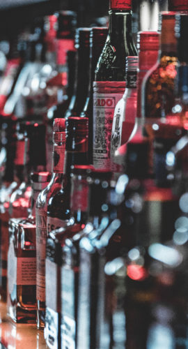 Selective focus photo of alcohol bottles