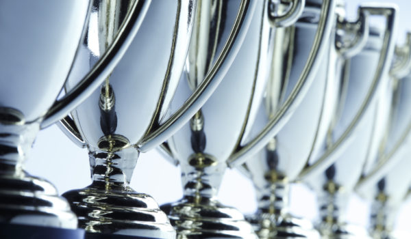 Close-up of a long row of trophies. Shot with shallow depth of field.