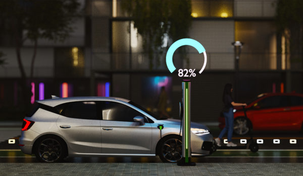 An electric vehicle at a charging station in the city at night. All items in the scene are 3D, charging station and concept cars are not based on any real ones.